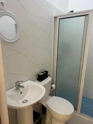 a bathroom with a toilet and a sink and a mirror at Casa de Mel&Niky in Paul