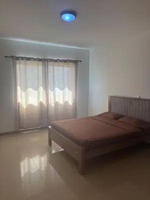 a bedroom with a bed and a window at Ocean of View in Mindelo