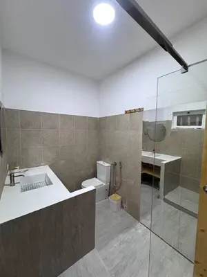 a bathroom with a shower and a sink and a toilet at Bounty Apartment Santa Maria by RPG Group in Santa Maria