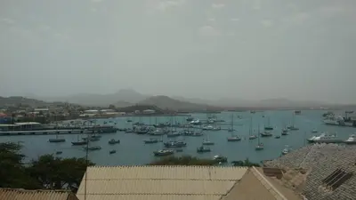 a harbor with boats docked in the water at Arla Residential in Mindelo