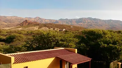 a house with a view of the mountains at Coin de Paradis,Pavillon Doucimar in Porto Novo