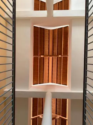a window in a building with wooden shutters at Pousada Praia Maria in Praia