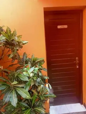 a black door with plants in front of a building at Aldeia Jerome in Paul
