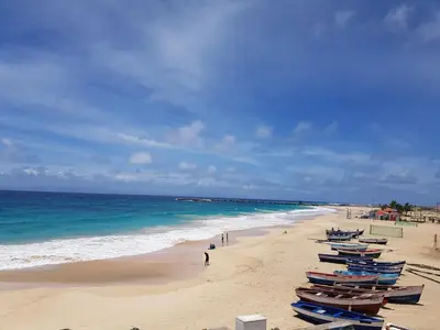 a beach with several boats sitting on the sand at Torre Sabina in Vila do Maio