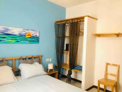 a bedroom with a bed and a painting on the wall at Two bedrooms, WIFI, near beach - Ca Greta in Sal Rei