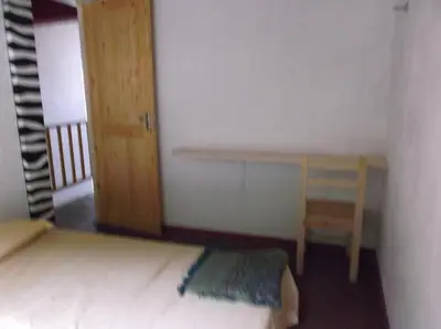 a small room with a bed and a desk at Misurino in Paul