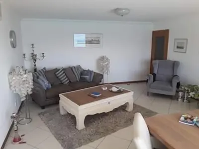 a living room with a couch and a coffee table at @Georgette in Mindelo