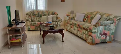 a living room with two couches and a coffee table at Apt. Idilfa in Praia