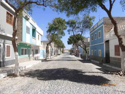 an empty street in a town with trees and buildings at Ca Madeira - 2bedroom, sea view & wifi in Sal Rei