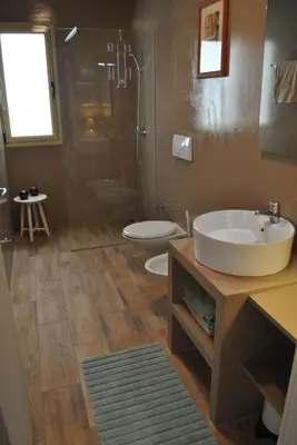 a bathroom with a sink and two toilets in it at Ca Madeira - 2bedroom, sea view & wifi in Sal Rei