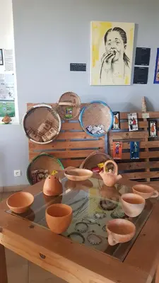 a glass table with bowls and baskets on it at Cote de France in Fundura