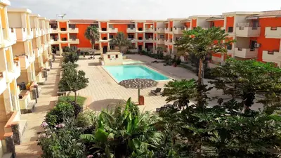 an aerial view of an apartment complex with a swimming pool at Sal Apartments Djadsal Moradias in Santa Maria