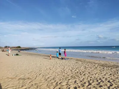 a group of people standing on a beach at Residence Amanda with pool in Santa Maria