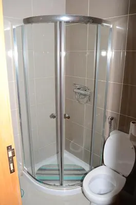 a shower stall with a toilet in a bathroom at Apartamento Rita in Praia