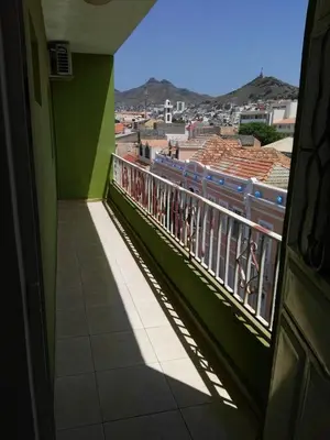 a balcony with a view of a city at Casa da Luz - Appartement in Mindelo