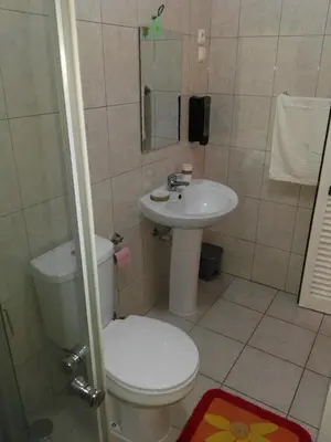 a bathroom with a toilet and a sink at Casa da Luz - Appartement in Mindelo