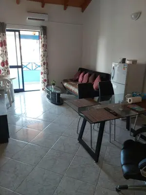 a living room with a couch and a table at Casa Azul One Rua da Morna Santa Maria in Santa Maria