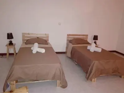 two beds in a room with two at Vannilla Residencial in Mindelo