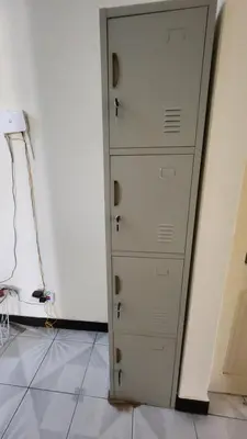 a white cabinet in a room with a wall at Meeting Point Hostels-Praia Beachwalk-NO CASH ACCEPTED-Also in Fogo & Tarrafal in Praia