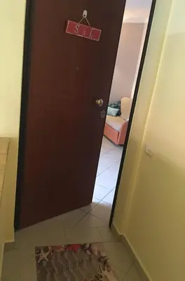 a door with a sign on it in a room at SAL at HOME in Santa Maria
