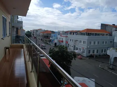 a balcony with a view of a city street at Pensao Mille Nuits in Tarrafal