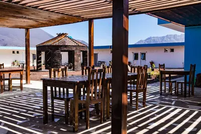 a table and chairs on a patio with a gazebo at Casa Marisa 2.0 in Portela
