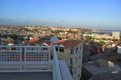 a view of a city from the balcony of a building at Apartamento Justino in Praia