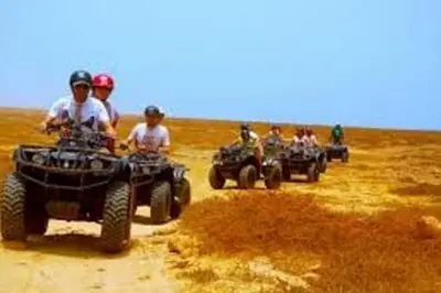 a group of people riding atvs in a field at Porto Antigo - Charming & peaceful apartment overlooking pool and sea in Santa Maria