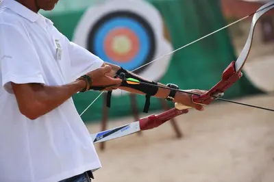 a man is holding a bow and arrow at Hotel Morabeza in Santa Maria