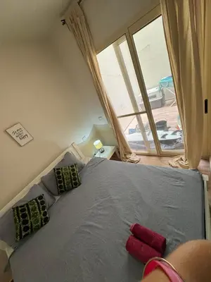 a bedroom with a bed with two pillows and a window at CA MINHA Praia Estoril Sal Rei Boa Vista in Sal Rei