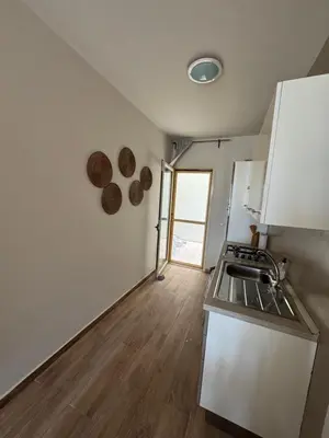 a kitchen with a sink and a counter top at CA MINHA Praia Estoril Sal Rei Boa Vista in Sal Rei