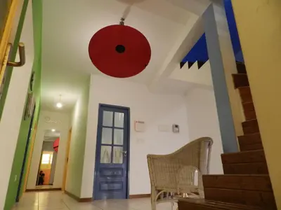 a room with a red orb hanging from the ceiling at La Residencia in Mindelo