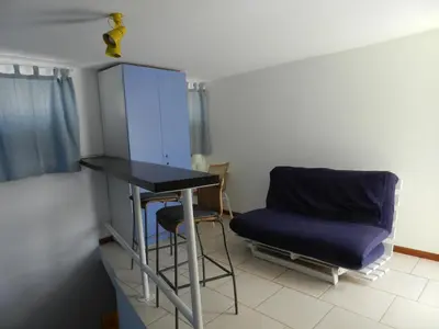 a room with a table and a chair in it at La Residencia in Mindelo