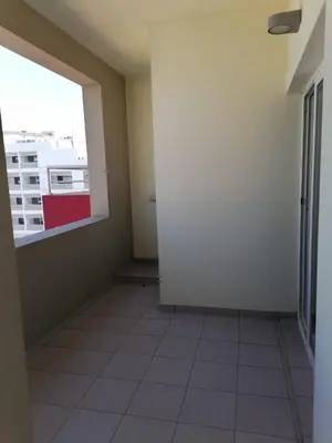an empty room with a window and a tile floor at SGC Boa Vista Apartments in Sal Rei
