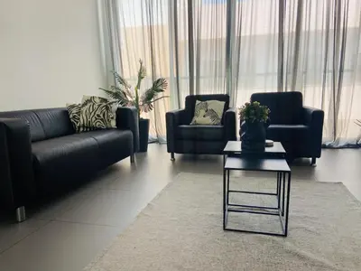 a living room with two couches and a coffee table at Morabezahome in Mindelo