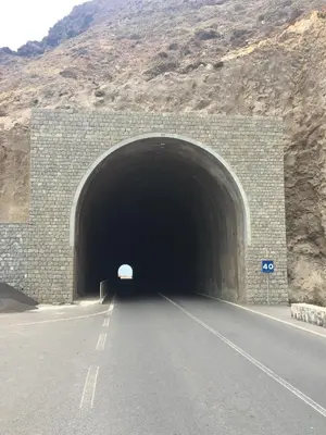 a tunnel with a road going through it at Guest House Frontera in Pinto