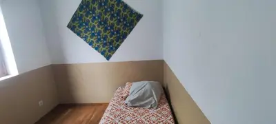 a small room with a bed in the corner at Casa Verde in Mindelo