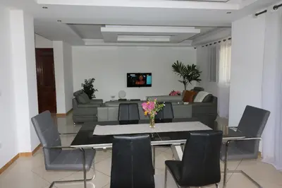 a dining room with a table and chairs at Lali's House in Tarrafal