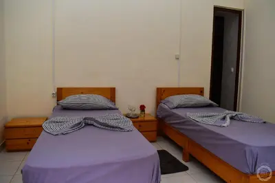 two beds sitting next to each other in a room at casa xoxo in Ribeira Grande