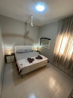 a bedroom with a bed and a mirror on the wall at sea View Nautilus free wi-fi Sal Rei in Sal Rei