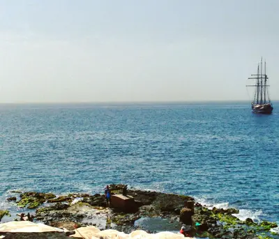 a boat in the ocean with a large body of water at bed & breakfast Regina in Tarrafal