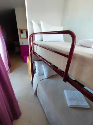 a couple of bunk beds in a room at Hotel Belvedere Mindelo, Cabo Verde in Mindelo