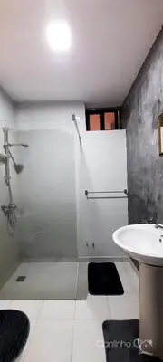 a bathroom with a shower and a sink at Cantinho C - Alojamento Complementar in Praia