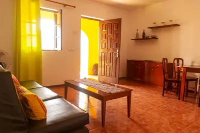 a living room with a couch and a table at Misturod - Holiday Apartments in Santa Maria