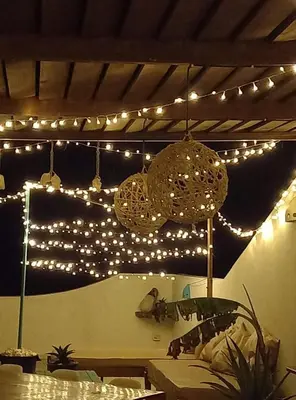 a room with lights hanging from a ceiling at B&B Sereia Azul Boa Vista in Sal Rei