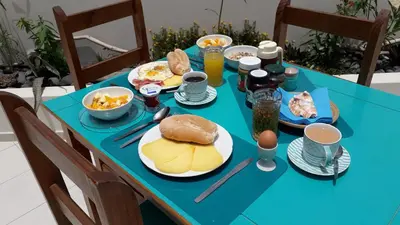 a blue table with breakfast food on it at B&B Sereia Azul Boa Vista in Sal Rei