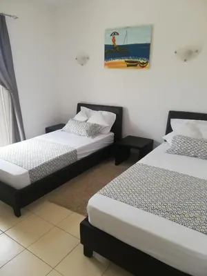 a bedroom with two beds and a painting on the wall at Apartment in Vila Verde - Pool view - Santa Maria in Santa Maria