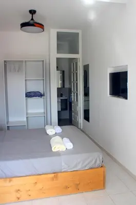 a bedroom with a bed with two towels on it at Residence A Paz in Boa Ventura