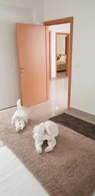 two towels on the floor in a room at Apartamentos DECOR in Tarrafal