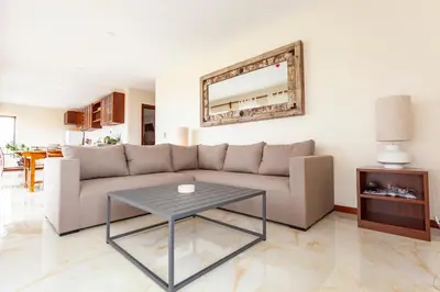 a living room with a couch and a table at Angulo House in Santa Maria